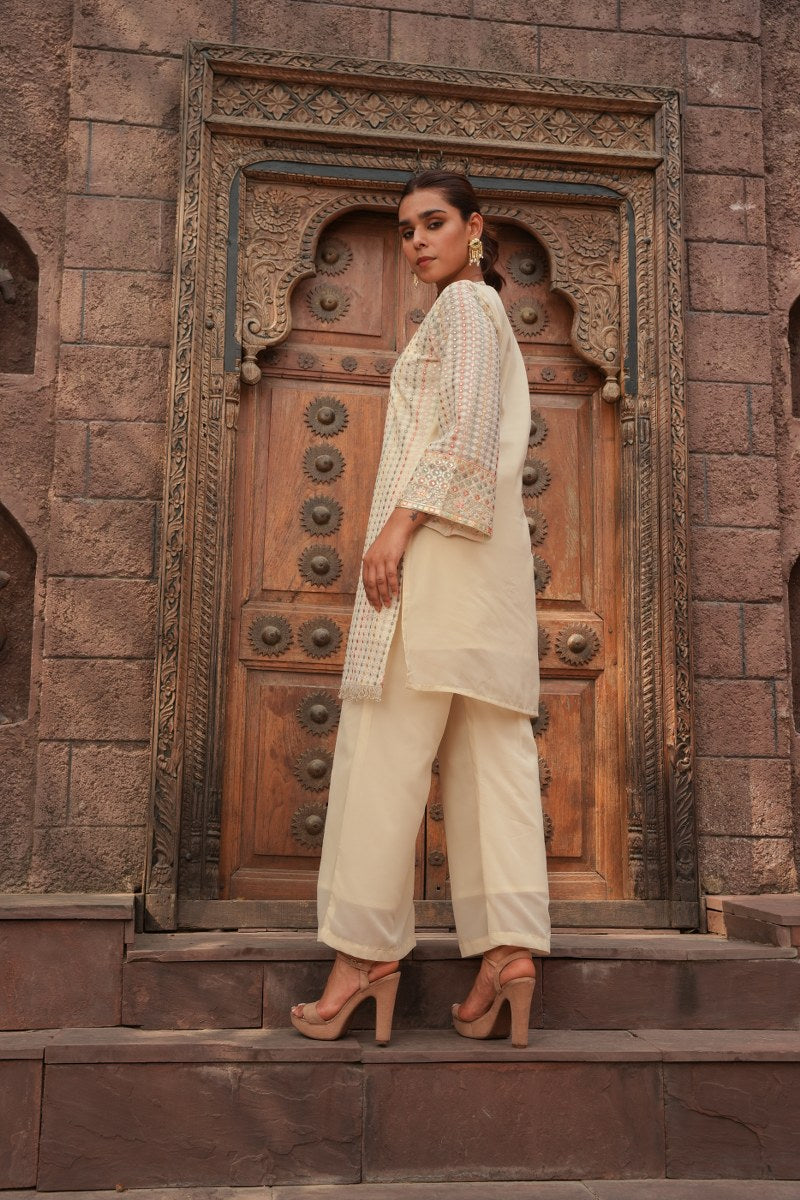 Cream Embellished Knee Length Kurta with Plazzo Set for Women