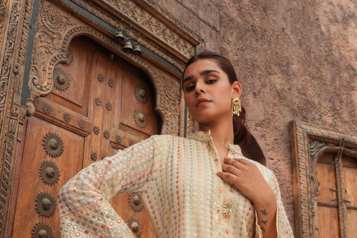 Cream Embellished Knee Length Kurta with Plazzo Set for Women