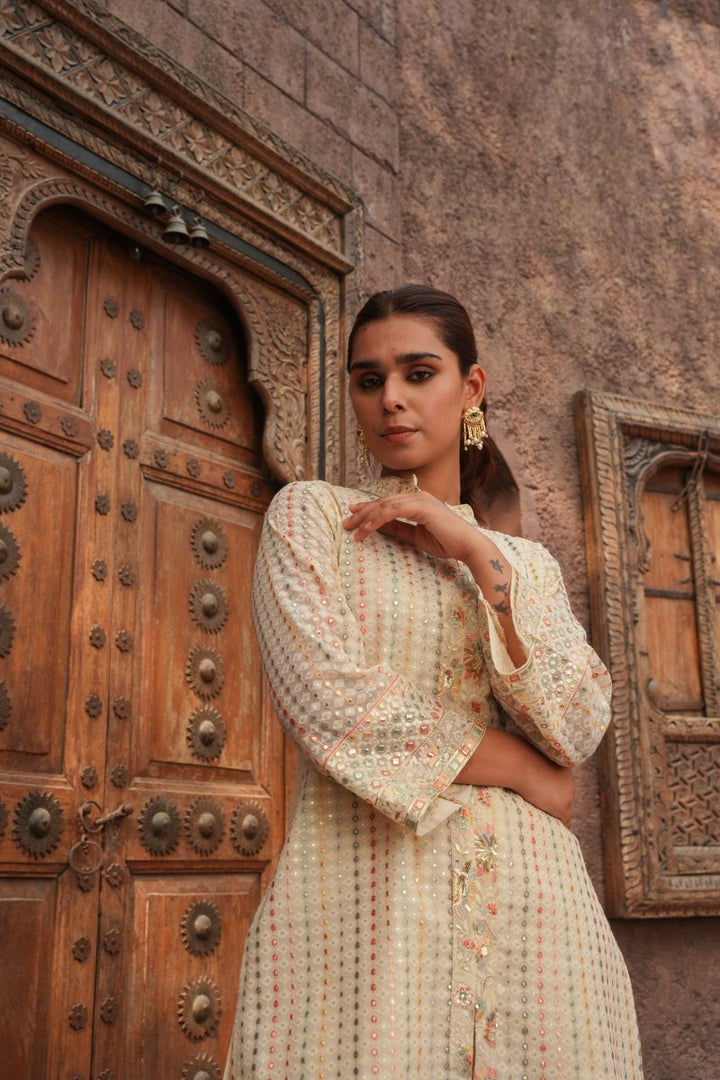 Cream Embellished Knee Length Kurta with Plazzo Set for Women