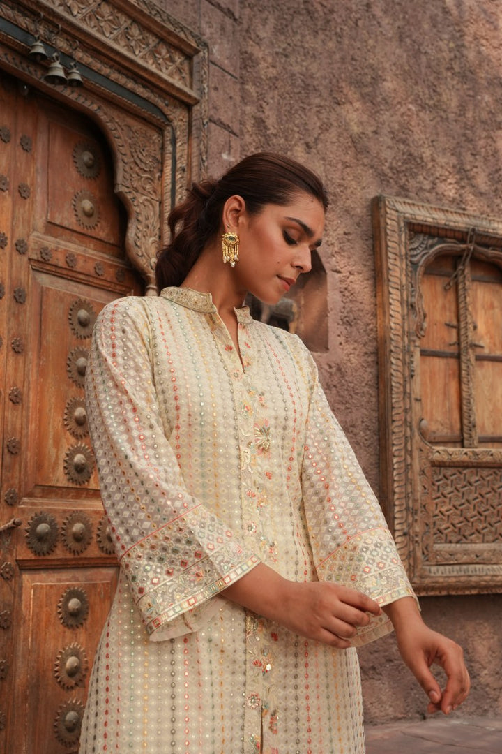 Cream Embellished Knee Length Kurta with Plazzo Set for Women