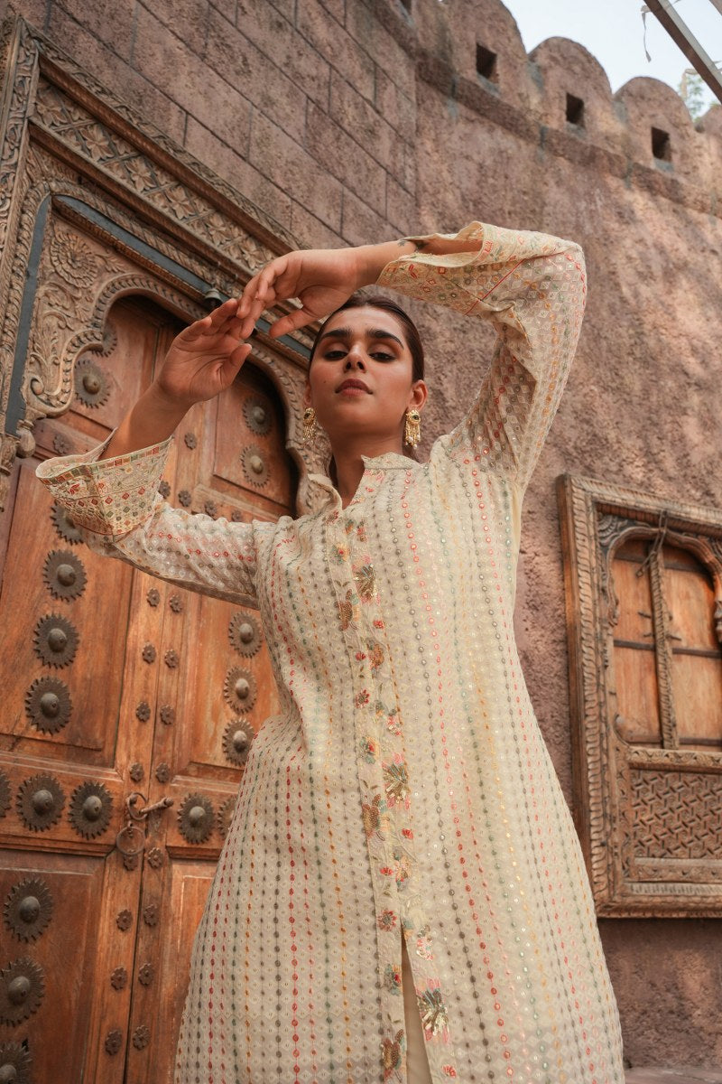 Cream Embellished Knee Length Kurta with Plazzo Set for Women